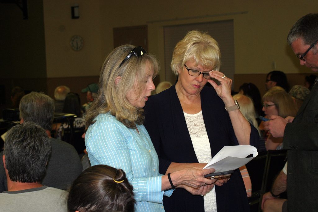 MP Cheryl Gallant, on the right with MPP Dr. Merrilee Fullerton at last Tuesday's flood meeting in Constance Bay, is requesting the federal government provide funding for those affected by the flood. Photo by Jake Davies