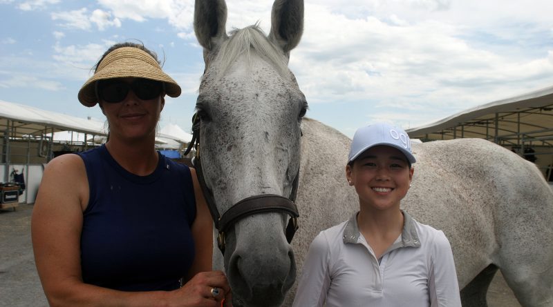 At right, Erin Wormald, 14, with her horse Goa and coach Sophia Nihon pose for a photo just prior to getting ready to compete Saturday afternoon. Photo by Jake Davies