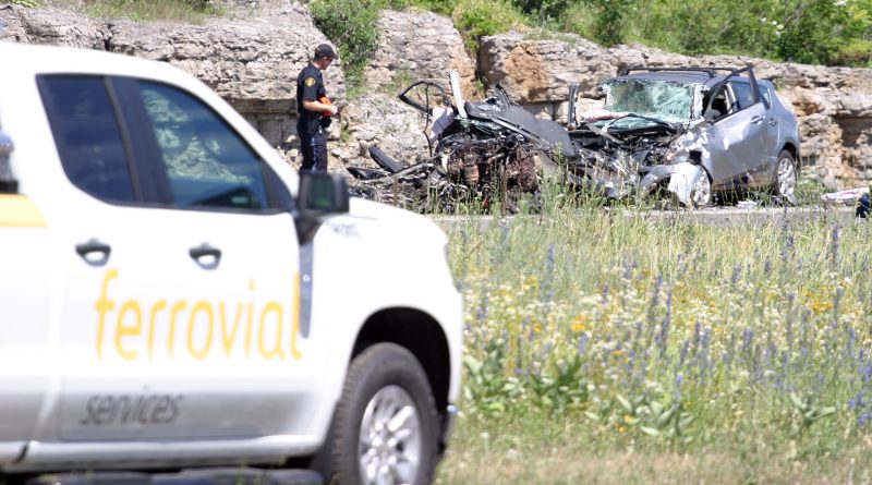 An Ottawa police constable surveys the scene at a July 7, horrific multi-vehicle collision on Highway 417 near Panmure. Photo by Jake Davies