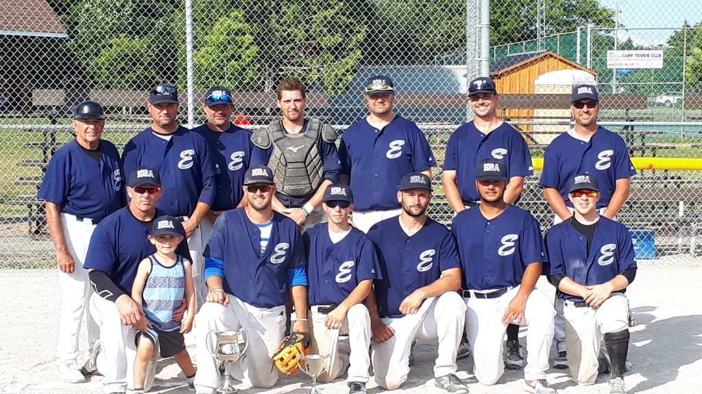 The Elkland Beverage Company fastball team poses for a photo after three-peating at the Gil Read Memorial Fastball Tournament. Courtesy @FitzroyFastball Twitter