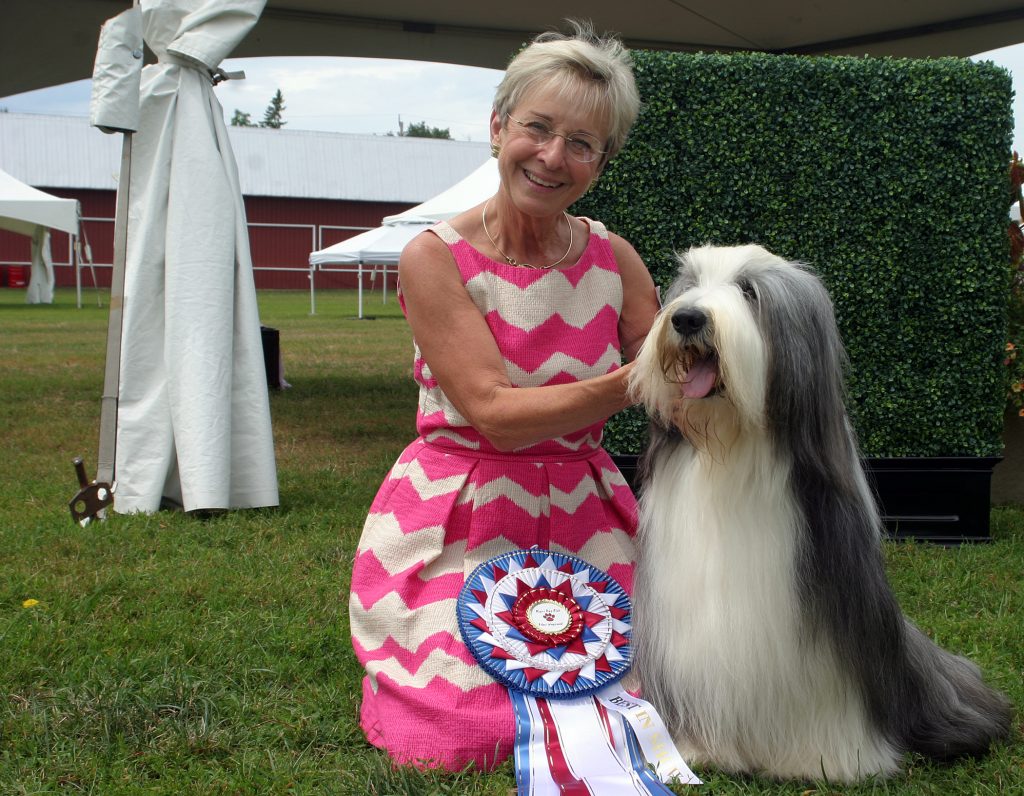 Maryland's Lucy Campbell poses with her Bearded Collie Henry who was named Best in Show on Monday. Photo by Jake Davies