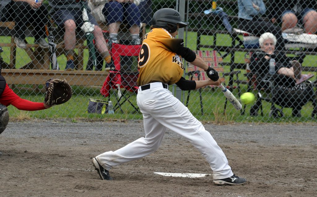 Wellesley's Cole Bender hits a single in early OASA elimination action. Photo by Jake Davies