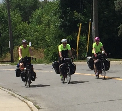 Friend Alison Green captures the arrival of the three long-distance pedalers who have raised $1,600 for the Brain Tumour Foundation. Photo by Alison Green