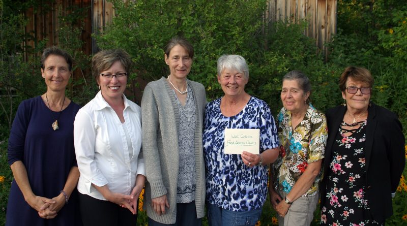 The Carp Ridge EcoWellness Centre made an $8,000 donation to the West Carleton Food Access Centre last Thursday (Aug. 15). From left are, Carp Ridge EcoWellness Centre owner Dr. Katherine Willow, centre board members Monika Miller, Chair Jacqui Ehninger, WCFAC’s Sharon Roper and Mary Braun and board member Lisa Probst. Photo by Jake Davies