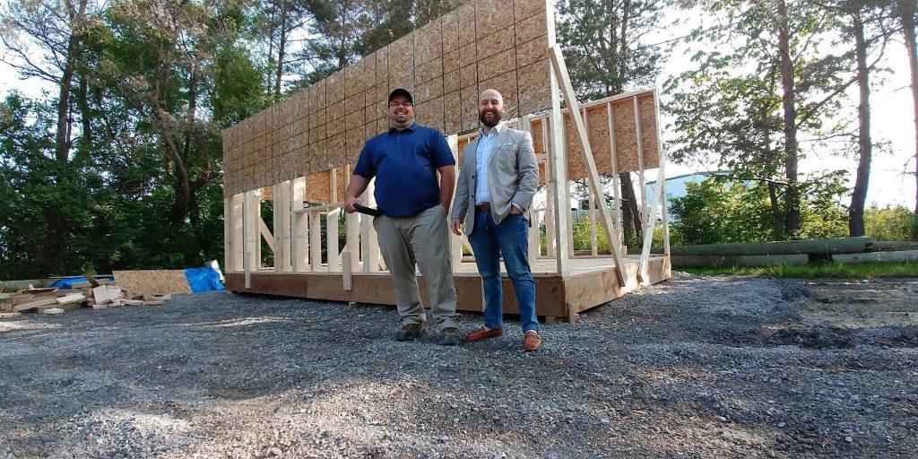 Simon Feizo-Gas and Patrick Lamothe pose during the model home construction's early days. Courtesy Feizo-Gas