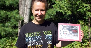 West Carleton Terry Fox Run Mila Dolezalova shows off this year's t-shirt and West Carleton's 2018 Milestone Award all in photo. Photo by Jake Davies