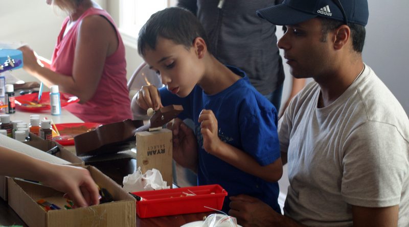 DIY'ers took advantage of the opportunity to build their own ukuleles last Thursday in Carp. Photo by Jake Davies