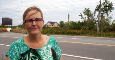 Dr. Jen Purdy, photographed in Dunrobin while a house destroyed by last year's tornado is rebuilt in the background, says the Greens are the only ones with a feasible plan for the environment. Photo by Jake Davies