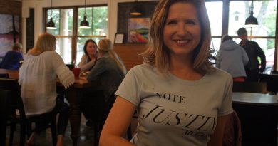 Federal Conservative candidate Justina McCaffrey, photographed at Alice's Village Cafe in her nomination t-shirt, says she wants to put money back in voters' pockets. Photo by Jake Davies