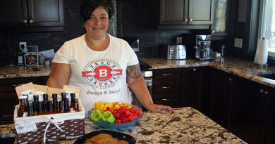 Carp’s Bahareh Tabrizi in her kitchen with her sauces and some spicy chocolate chip cookies. Photo by Jake Davies