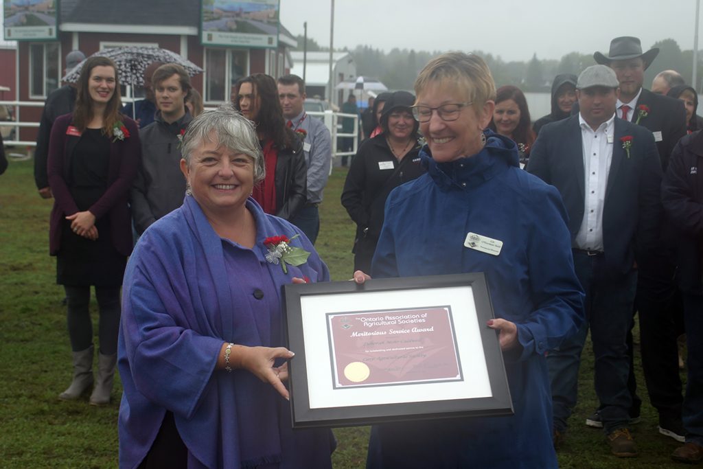  The Meritorious Service Award is awarded by the Ontario Association of Agricultural Societies on the recommendation of the Carp Agricultural Society for meritorious service to agriculture. Recipients are deemed to have made a valuable contribution to one or more aspects of the agricultural life of the community. This year’s recipient is Deborah Mohr-Caldwell (at left) and was presented by the Ontario Association of Agriculture Societies vice president Liz O'Gorman-Smit. Photo by Jake Davies 