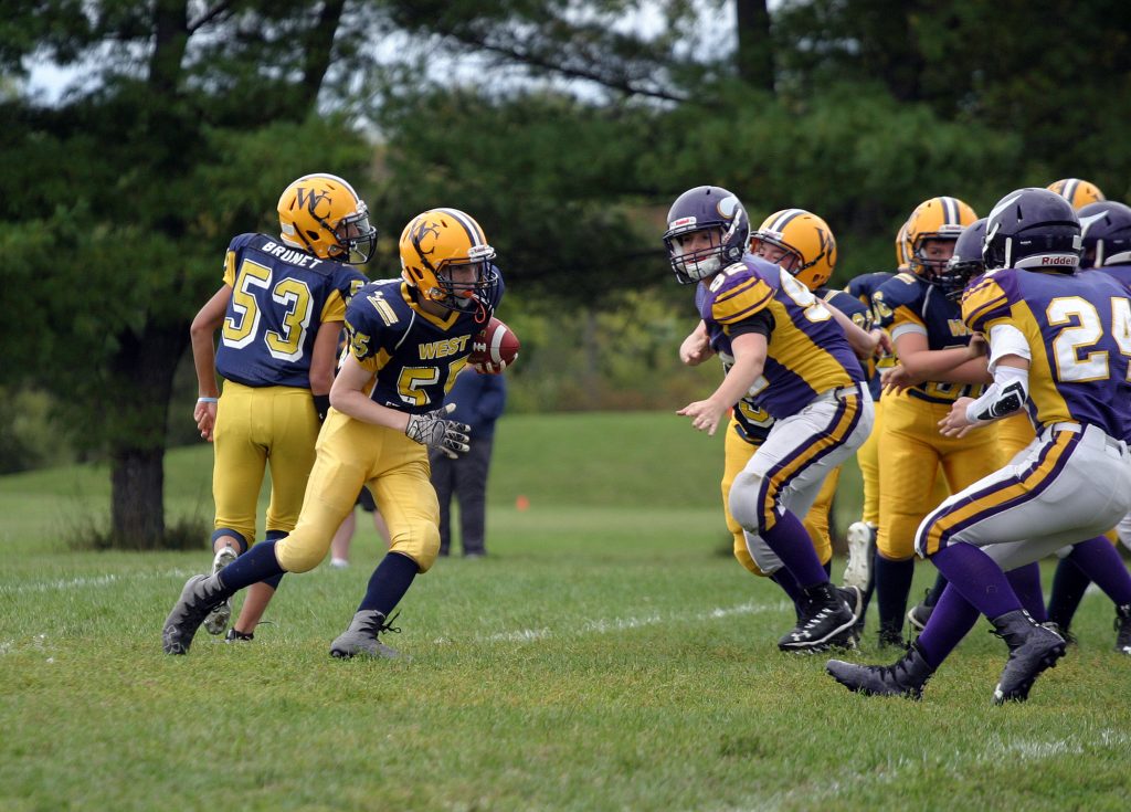 Runningback Owen Redmond looks for a hole during the Wolverines last game, a win against the Gatineau Vikings. Photo by Jake Davies