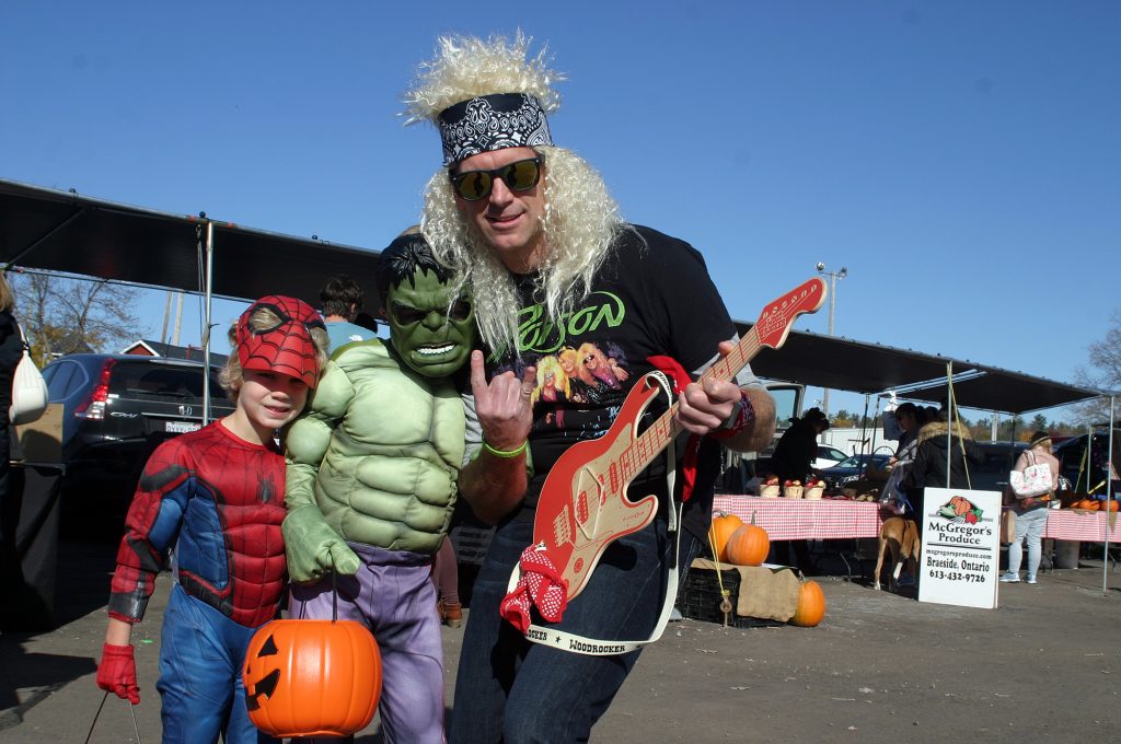 Nathan, 5, Paul, 8, and dad Anthony were ready to websling, smash and rock out at the Carp Farmers' Market Saturday. Photo by Jake Davies﻿