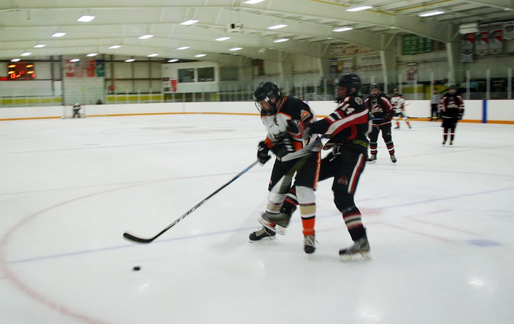 Carp's Corey Symington battles for the puck in last Sunday's win. Photo by Jake Davies