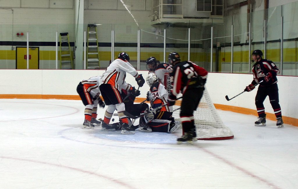 Cheung battles through a pile of players to find the puck in a goal mouth scramble Sunday afternoon. Photo by Jake Davies