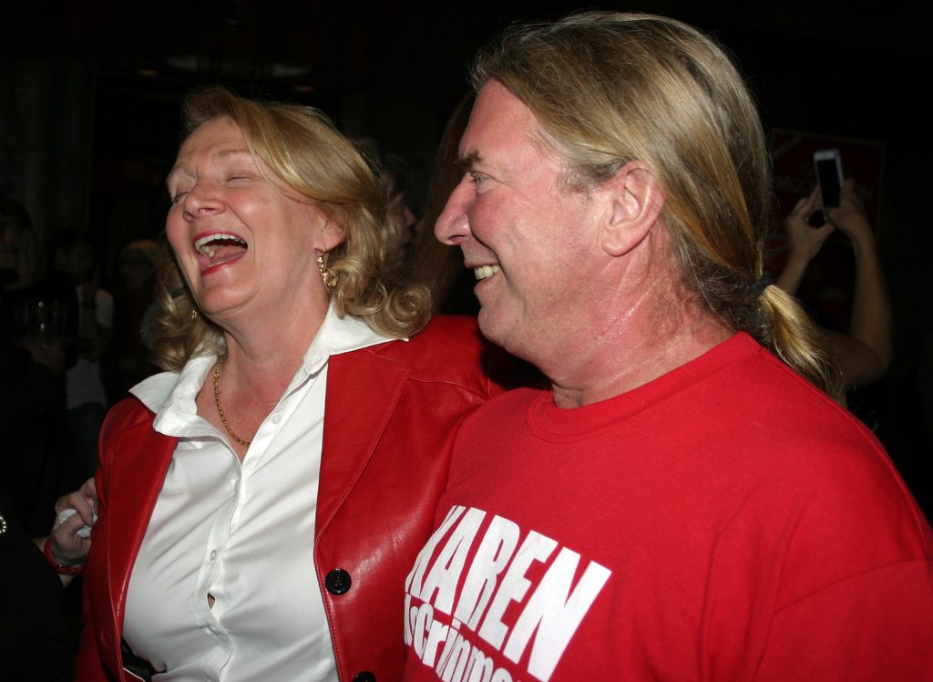 Karen McCrimmon shares a laugh with her husband after her victory. Photo by Jake Davies﻿