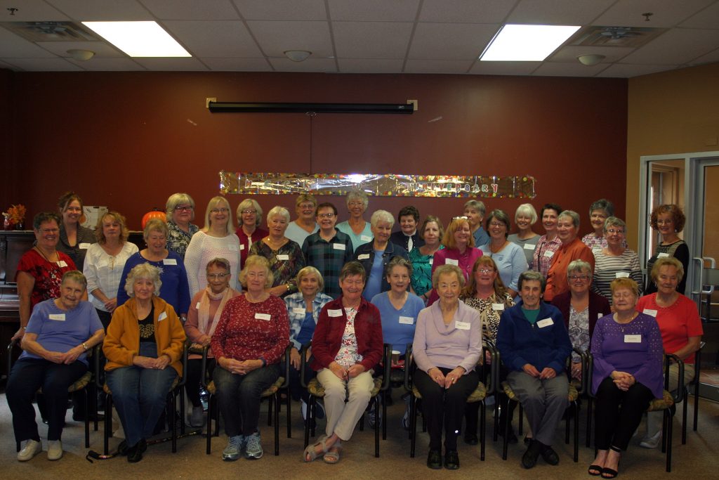 Members of the West Carleton Country Knitters pose for a photo on their 10th anniversary. Photo by Jake Davies