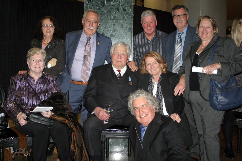 Dr. Roly Armitage, centre, poses with several of his many friends and family (but not all) who attended the ceremony. Photo by Jake Davies