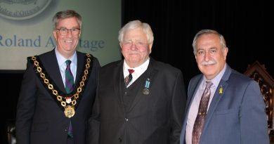 From left, Mayor Jim Watson, Dr. Roly Armitage and Coun. Eli El-Chantiry pose for a photo following the medal presentation. Photo by Jake Davies