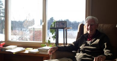 Rev, Jack Lougheed sits in the family home his wife grew up in with a beautiful living-room view of the Grand River in this photo taken Nov. 12. Photo by Jake Davies