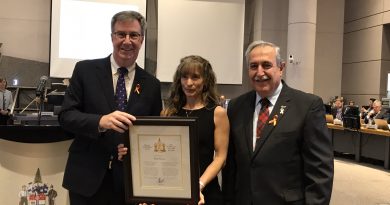 Mayor Jim Watson and Coun. Eli El-Chantiry present Kim Steele with the Mayor's City Builder award this morning (Nov. 27). Courtesy the City of Ottawa