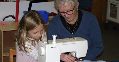 Cherith Cook shows Charlotte MacIsaac how to use a sewing maching at the So You Can Sew event Nov. 7. Photo by Jake Davies