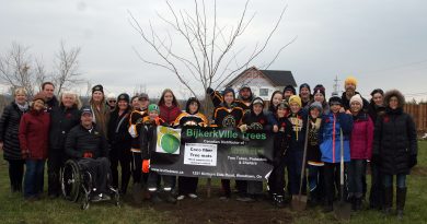 The Warriors, parents, coaches, members of the Women's Institute, the DCA, sponsors and community members pose beside the freshly planted Canadian Red Maple last fall provided by BijkerkVille Trees. Photo by Jake Davies