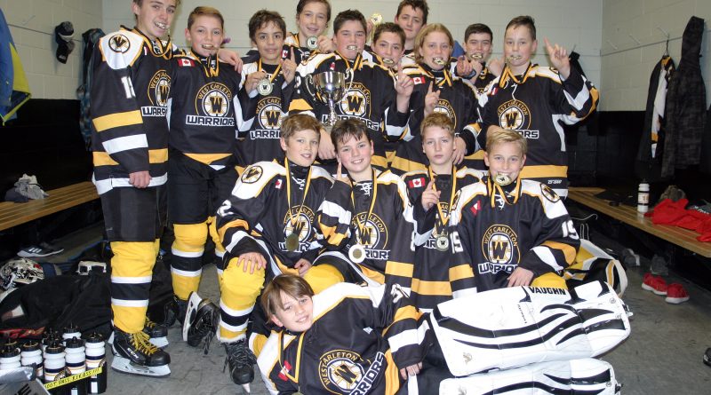 The Warriors peewee A team poses for a photo after winning their home tournament last weekend. Photo by Jake Davies