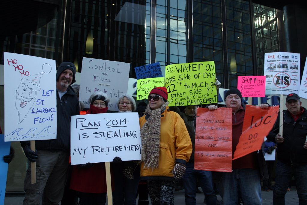 West Carleton protesters, including Bruce McClure (far left) pose for a photo during the rally. Photo by Jake Davies