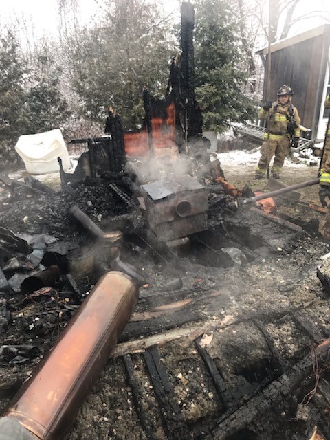 An afternoon fire destroyed this Dwyer Hill Road home but an occupant and dog were able to escape unharmed. Courtesy the OFS 