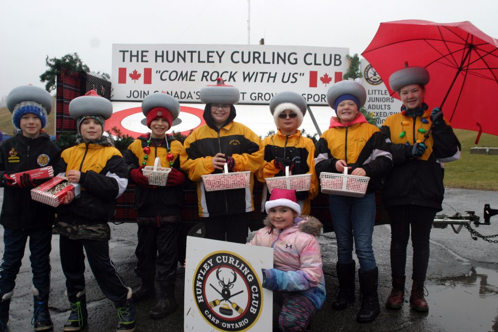 The Huntley Curling Club needed fewer umbrellas thanks to some inventive headwear. Photo by Jake Davies