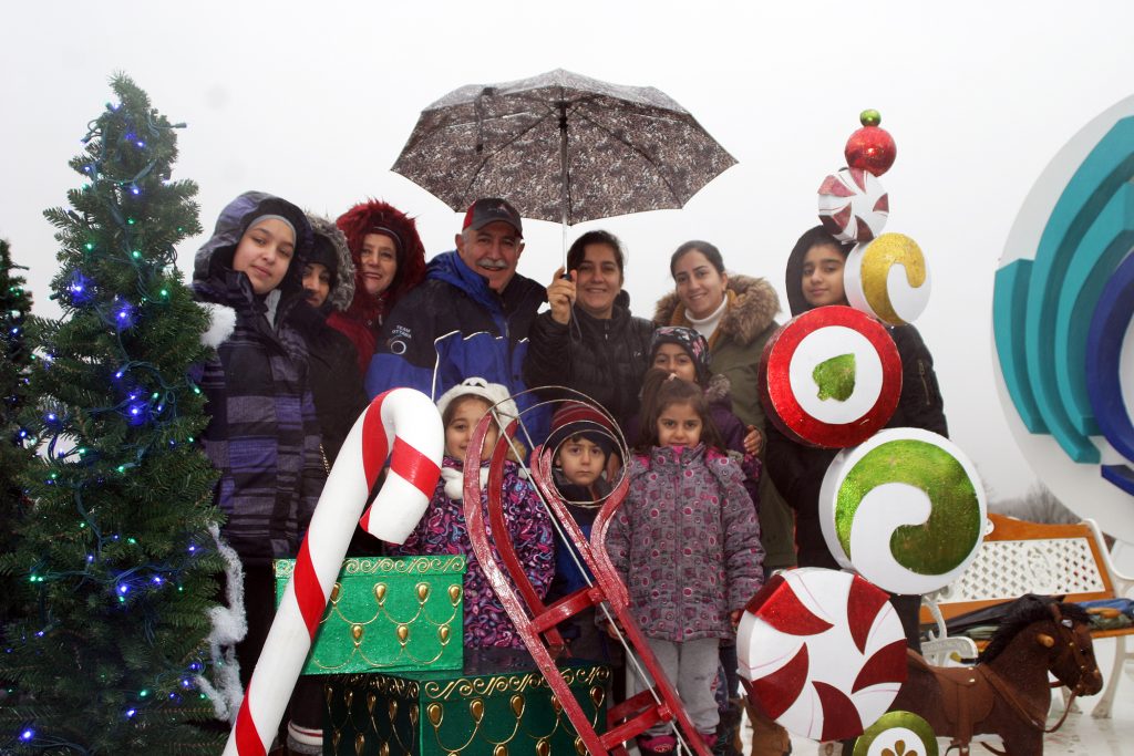 Coun. Eli El-Chantiry, his wife Maha and their friends and family on the City of Ottawa float. Photo by Jake Davies