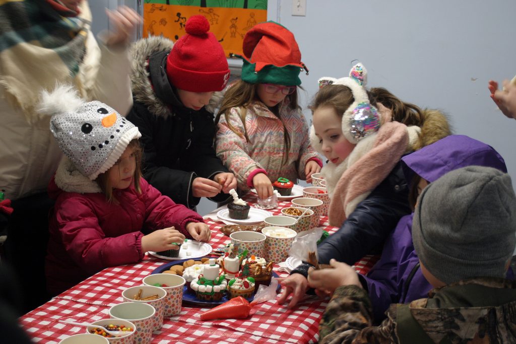 Michelle Jefferies' cupcake making station was a popular spot. Photo by Jake Davies