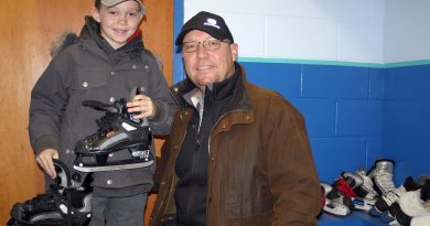 Constance Bay's Burke, 8, and dad Corey Griffin dropped by Saturday's WCOHL equipment exchange to prepare for the upcoming outdoor hockey season. Photo by Jake Davies