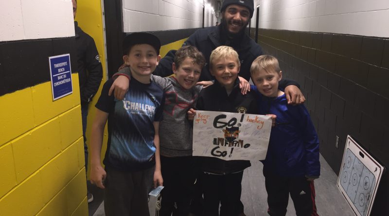 West Carleton Inferno Captain Josh McColl-Williams poses with young fans who won the Jan. 5 Cheer Poster competition He is one of five Inferno membes off to the NCJHL All-Star Game Feb. 14. Coutesy the Inferno