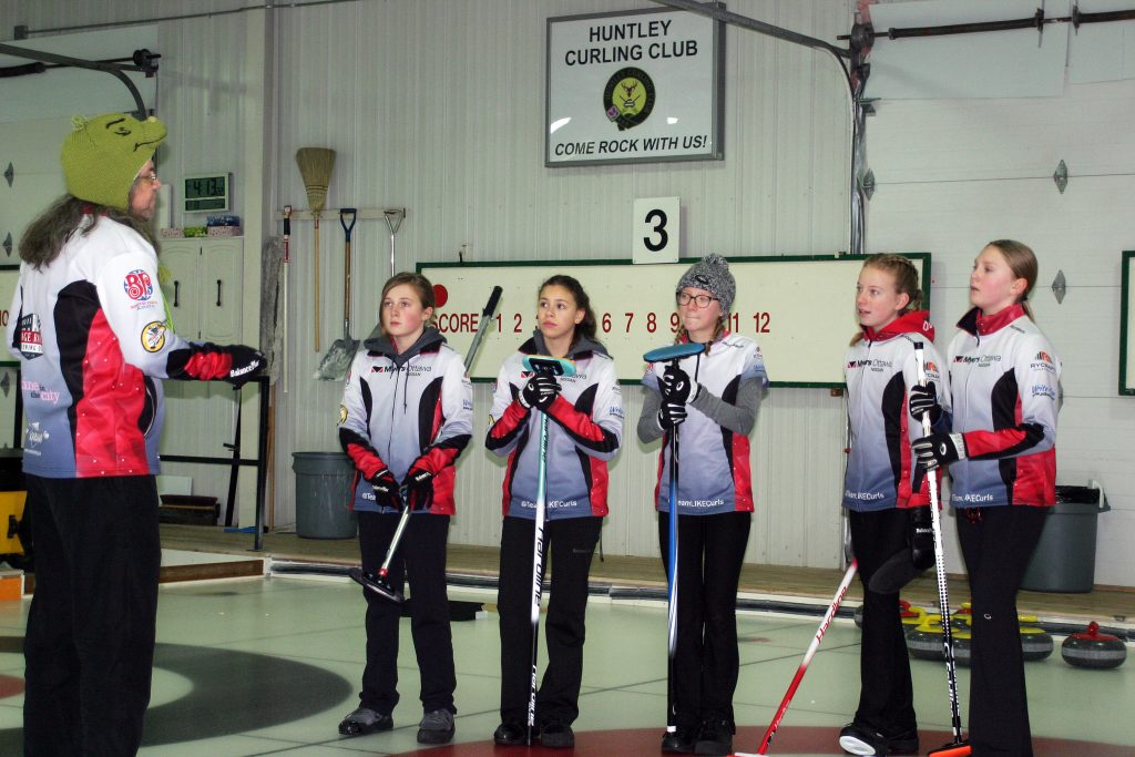 Team LIKE gets down to practice, led by coach Lou Frlan (far left) at the Huntley Curling Club last Monday. Photo by Jake Davies