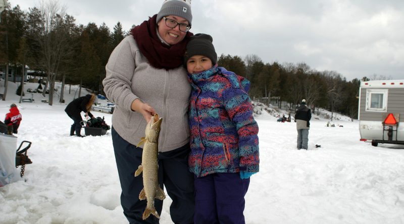 Ottawa's Sofia Groulx, 8, shows off her pike with mom Darquise Groulx who grew up in Kinburn. Photo by Jake Davies