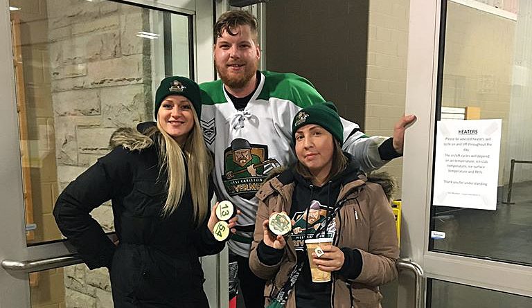 Dunrobin native Lexie York, far right with team owner-player Adrian Moyes and his wife Ashley, was back in the rink supporting the Rivermen at the team's first ever playoff game - an overtime thriller. Courtesy the Rivermen