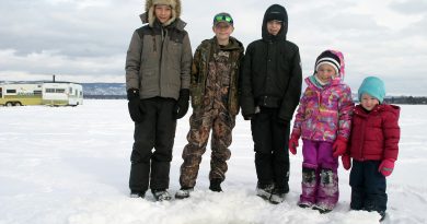 From left, Jordan Atherfold, 12, Cody Atherfold, 11, Nathan Pederson, 12, Grace Boyd, 6, and Hailey Boyd, 3, drop a hook at the WCFGC annual ice fishing derby last Saturday. Photo by Jake Davies