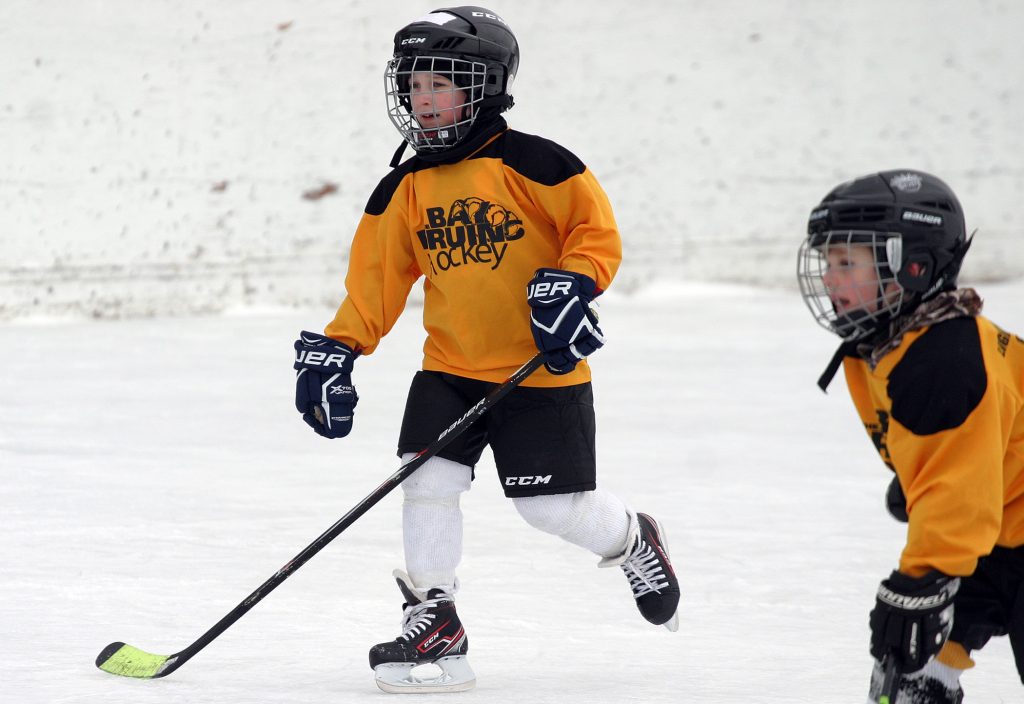 Constance Bay's Cooper  Jackson, 6, battles against Carp Saturday morning. Photo by Jake Davies