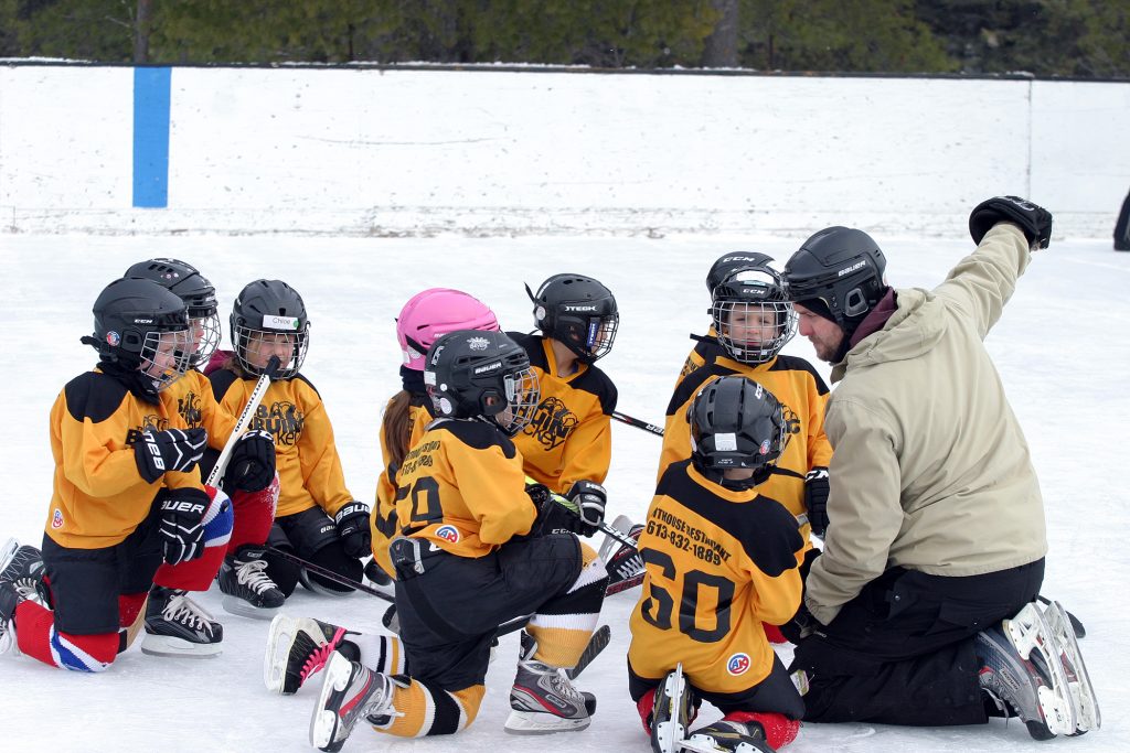 Constance Bay coach Phil Aldous gives some instruction to the team just before the ages five to seven teams get to work. Photo by Jake Davies