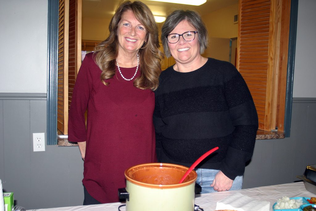 From left, Fitzroy Harbour Community Association board member Leigh Ann Kyte and President Karen Taylor were serving up chili Thursday night. Photo by Jake Davies