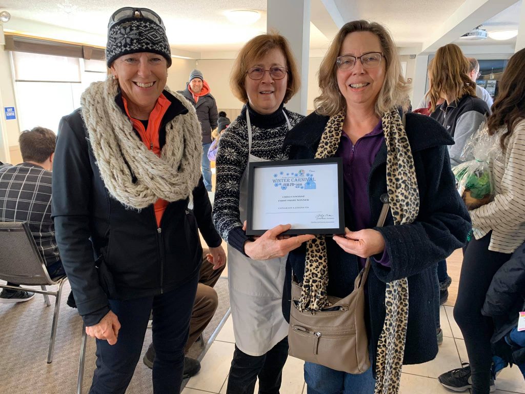 From left, HCA Carp Winter Carnival organizers Kathy Fisher and Judy Makin present chili contest winner Lori Gariepy with her certificate. Courtesy the HCA