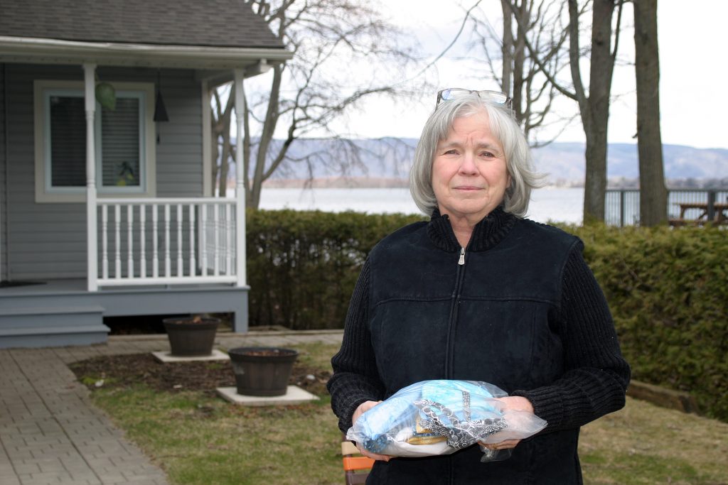 Constance Bay’s Janet McKeen-Peterkin donates 14 scrub caps she made after hearing of the need. Photo by Jake Davies