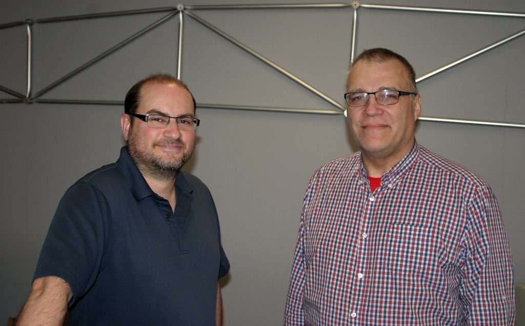 From left, Triodetic's David Levy and Peter Chabursky pose in front of the company's patented foundation design. Photo by Jake Davies