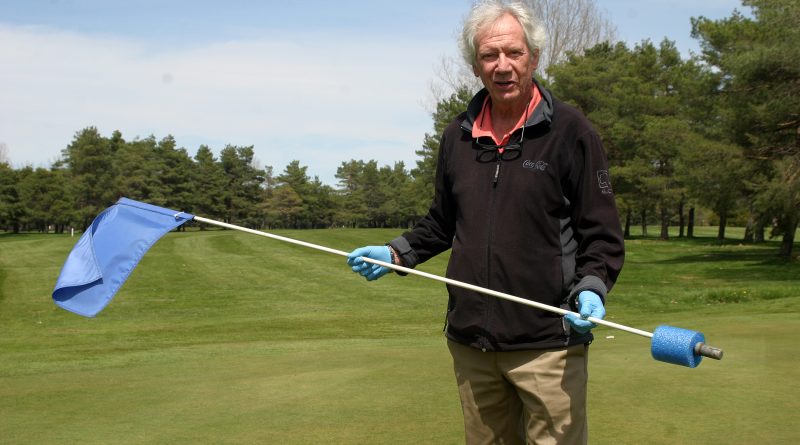 Madawaska Golf Club owner Rick Munro shows off the new flag sticks from the 18th green which prevent balls from going in to the hole. Photo by Jake Davies