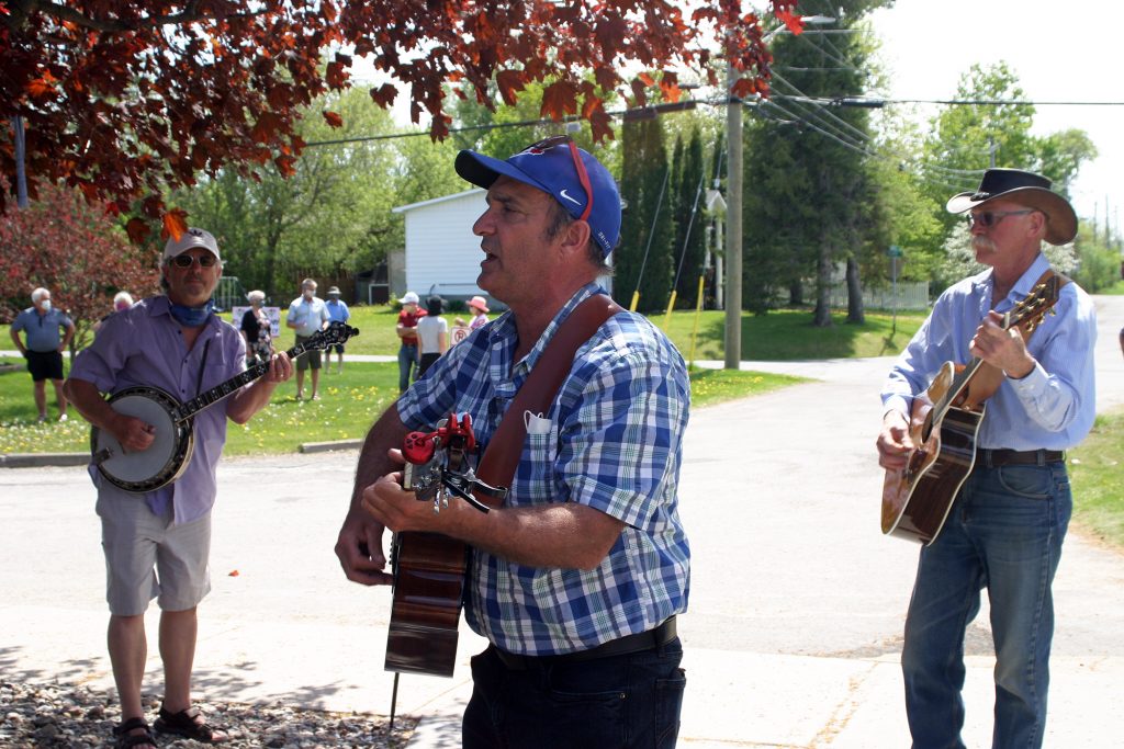 From left, nephews Billy Wilson, Wendel Wilson and Kevin Davis perform the Good Old Hockey Game for the Tripps. Photo by Jake Davies