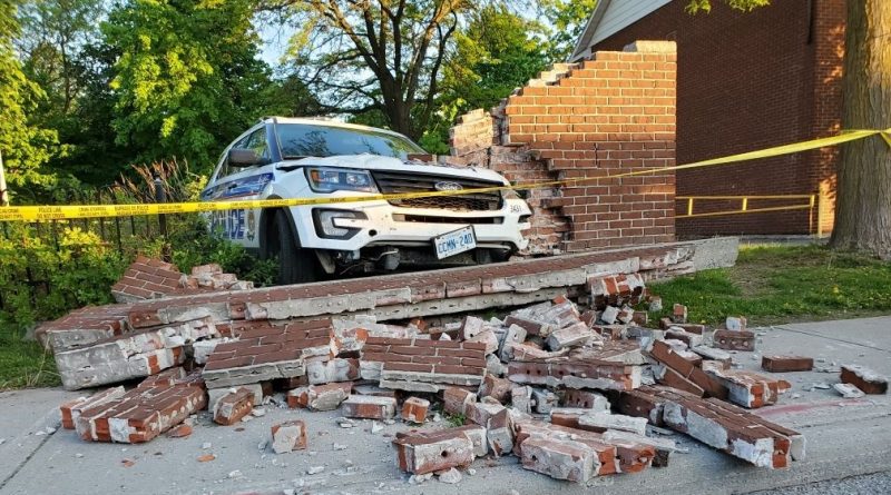 A suspect, fleeing in a police cruiser Monday, crashed through a wall driving through a park. Courtesy the OPS