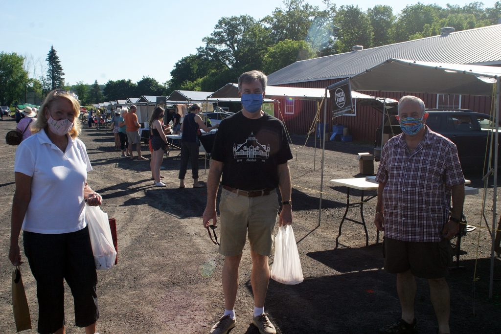 From left, MP Karen McCrimmon, Mayor Jim Watson and Coun. Eli El-Chantiry were some of the very first customers at Saturday's market. Photo by Jake Davies