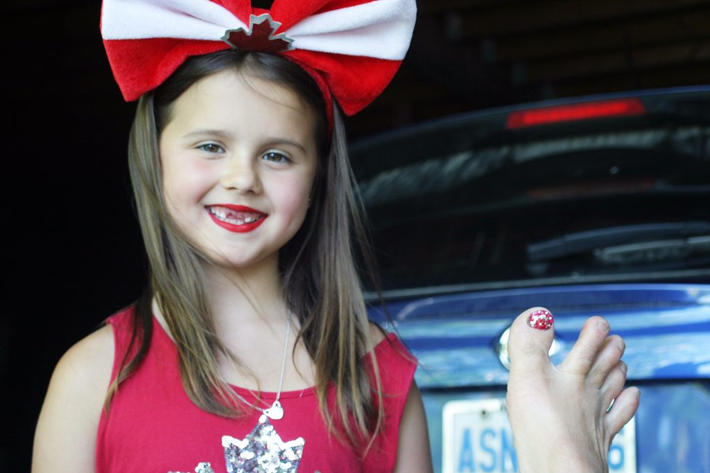 Ken and Judy Borg's grandchild Olive, 7, made sure Ken's big toe was suitably dressed for Canada Day. photo by Jake Davies